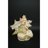 ROYAL DUX FIGURAL DISH of a Nymph playing an instrument, and seated on a conch shell. Marked,