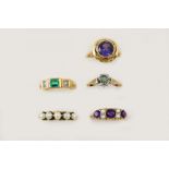 AN AMETHYST AND PEARL RING the three circular-cut amethysts are set with four half pearls, in