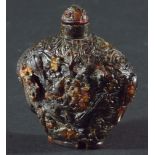 CHINESE AMBER SNUFF BOTTLE AND STOPPER, carved with birds in flowering branches, 8cm