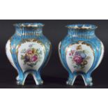 PAIR OF MINTON VASES, circa 1860, painted with alternating panels of cherubs and floral sprays on