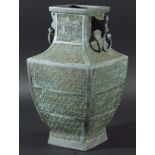 CHINESE BRONZE ARCHAISTIC VASE, of square section baluster form, with two scroll handles, the body