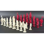 CHINESE CANTON IVORY PUZZLE BALL CHESS SET, late 19th century, natural and stained red, carved as