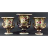 GARNITURE OF DERBY CAMPANA URNS, mid 19th century, painted with baskets of fruit on shelves on a
