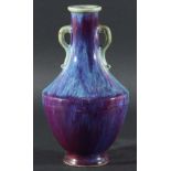 CHINESE FLAMBE VASE, of two handled baluster form, with a mauve to blue mottled glaze, Kangxi