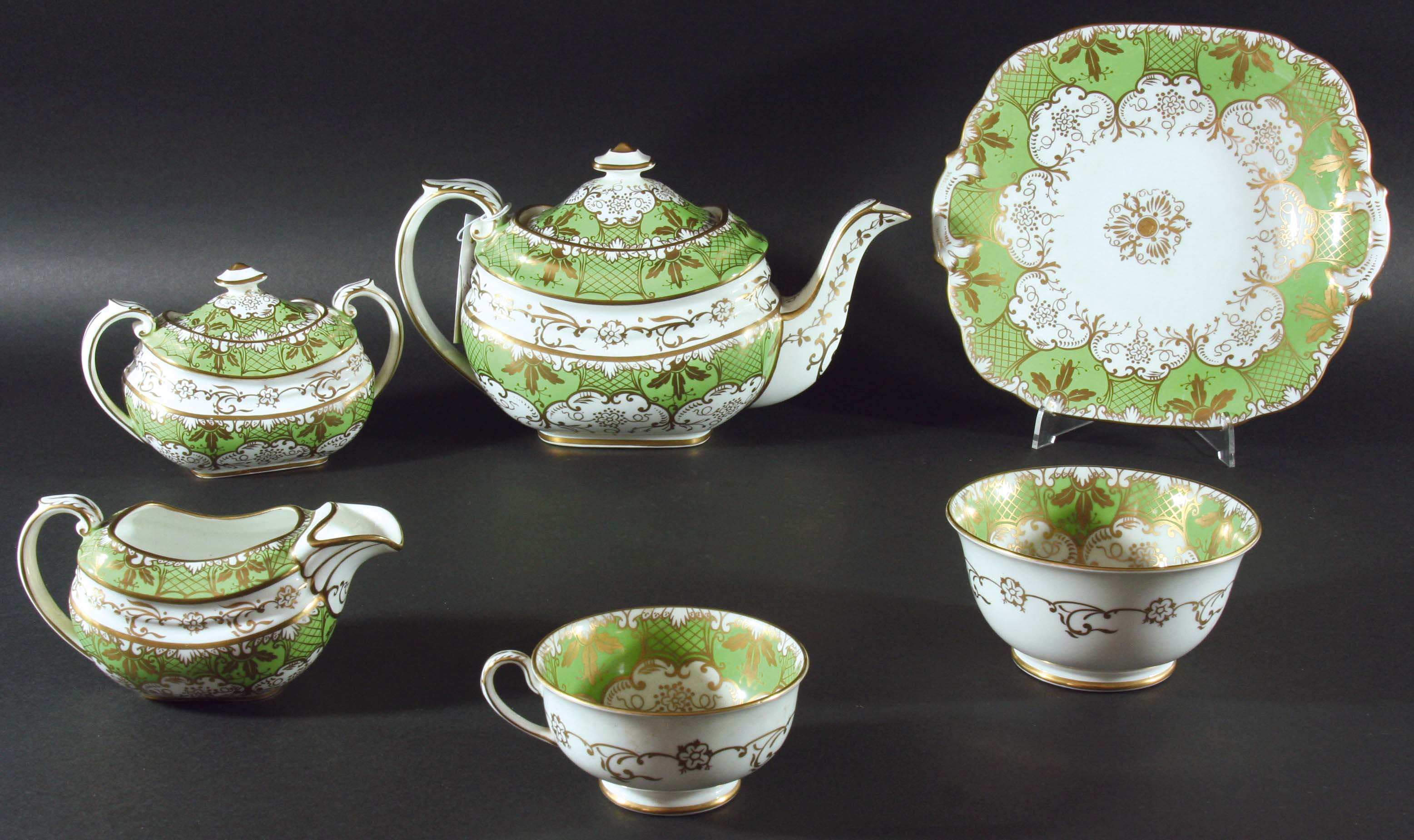 ROCKINGHAM STYLE TEA SERVICE, possibly Paragon Rockingham, with gilt scrolling decoration on an