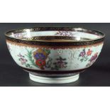 CHINESE EXPORT STYLE ARMORIAL BOWL, 19th century, painted with flowers and bianco sopra bianco