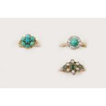 A TURQUOISE AND DIAMOND CLUSTER RING the circular turquoise cabochon is set within a surround of ten