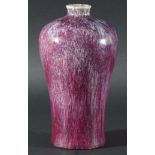 CHINESE FLAMBE MEIPING VASE, in a mottled red to mauve glaze, 20cm