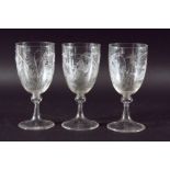 SET OF THREE WINE GLASSES, the rounded bowls engraved with underwater scenes of carp amongst weed,