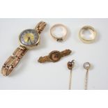 A QUANTITY OF JEWELLERY including a diamond solitaire and gold ring, a gold wristwatch on an