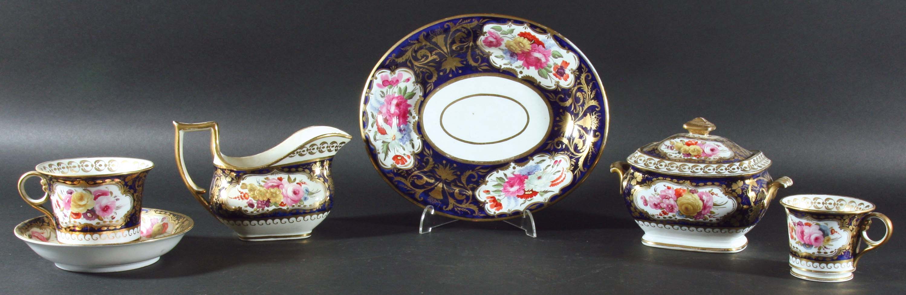 ENGLISH PORCELAIN PART SERVICE, mid 19th century, painted with floral sprays inside gilt