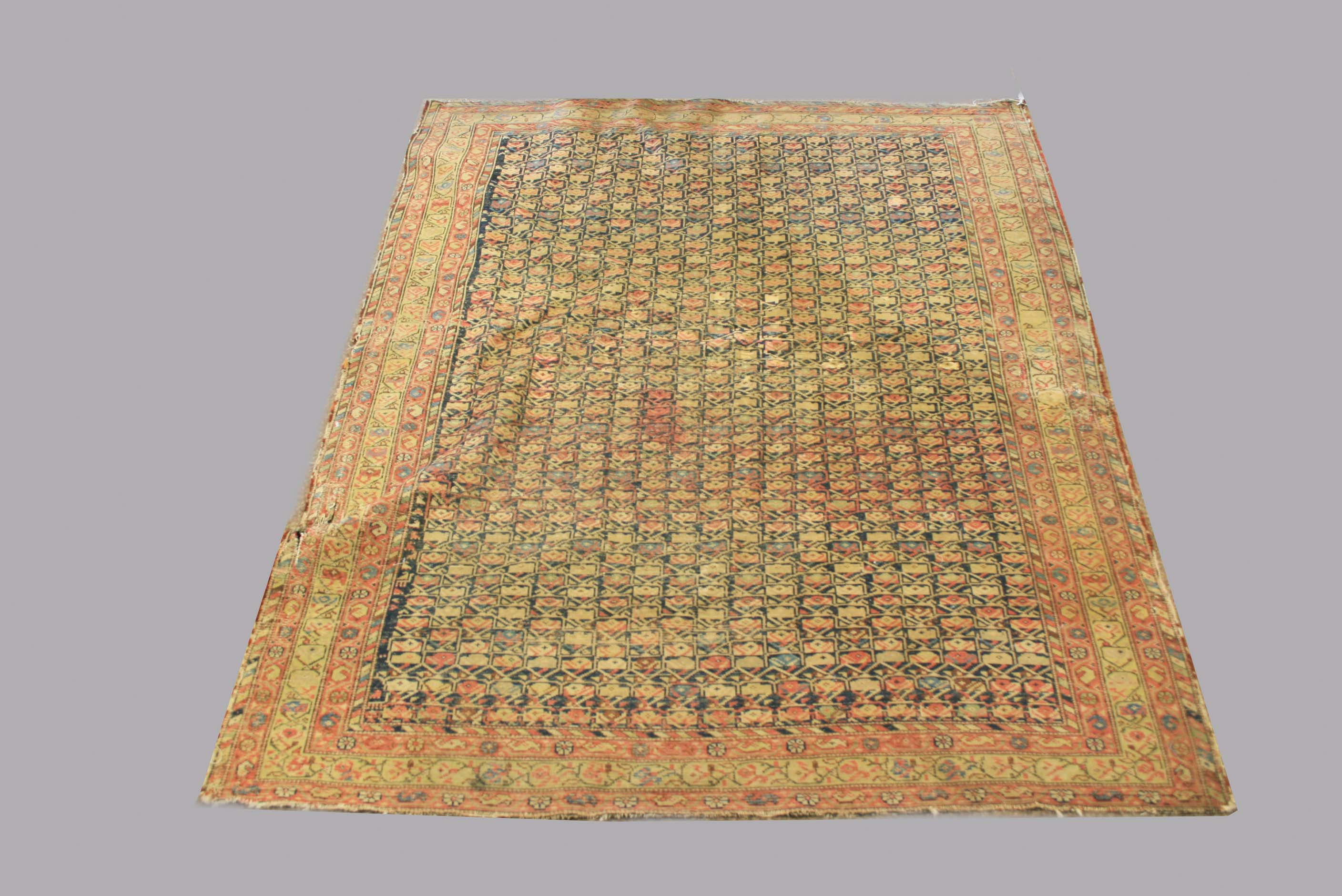 WEST PERSIAN VILLAGE RUG, probably Feraghan Valley, the indigo lattice field with columns of