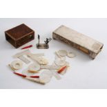 A MIXED LOT: A long matchbox mount, initialled, a wooden matchbox mount, a Dutch miniature or toy in