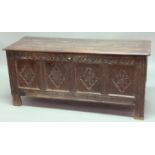 OAK COFFER, late 17th or early 18th century, the hinged cover above a four panelled front with