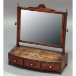 GEORGE III MAHOGANY TOILET MIRROR, the rectangular plate on a bow fronted base with three drawers,
