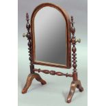 VICTORIAN WALNUT AND INLAID MINIATURE TOILET MIRROR, with arched plate on turned supports, height