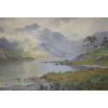 •EDWARD HORACE THOMPSON (1879-1949) A PASSING GLEAM: ULLSWATER FROM THE PATTERDALE END Signed and