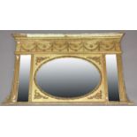 REGENCY OVER MANTLE MIRROR, the frieze with gilt gesso swags above an oval plate flanked by a pair