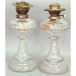 PAIR OF VICTORIAN CUT GLASS OIL LAMP BASES, the reservoir with arched and oval facets, on a