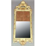 LOUIS XVI STYLE PIER MIRROR, 19th century, the arched top with painted and gilt gesso shell and swag