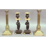 PAIR OF EMPIRE STYLE BRONZE AND GILT CANDLESTICKS 19th century, figural stems supporting sconces