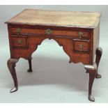 GEORGE II OAK AND WALNUT LOW BOY, with a single frieze drawer above two candle drawers flanking a