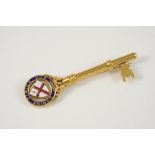 AN 18CT. GOLD AND ENAMEL PRESENTATION KEY mounted with the Coat of Arms for the City of London,