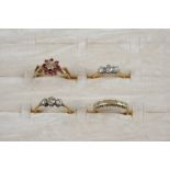 A DIAMOND THREE STONE RING set with three graduated old brilliant-cut diamonds, in gold, size I 1/2,