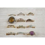 TWELVE ASSORTED GOLD AND GEM SET RINGS including an 18ct. white gold ring set with four square