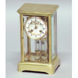FRENCH BRASS FOUR PANE CLOCK, the 3 1/4" enamelled dial with exposed anchor escapement on a brass