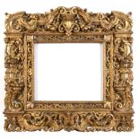 AN IMPRESSIVE `SANSOVINO` PICTURE FRAME 16/17th Century, boldly decorated with carved and gilded