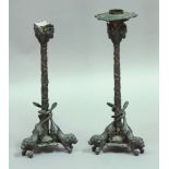 PAIR OF BRONZE EMPIRE STYLE CANDLESTICKS the sconce with goat masks and grapes, the stem with