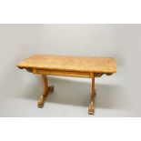 REGENCY POLLARD OAK LIBRARY TABLE, in the manner of George Bullock, the rounded rectangular top