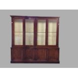 VICTORIAN MAHOGANY LIBRARY BOOKCASE, the moulded cornice above two pairs of glazed doors enclosing