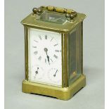 BRASS FOUR PANE CARRIAGE TIME PIECE, the enamelled dial with subsidiary day and date dials on a