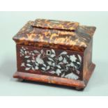 TORTOISESHELL TEA CADDY of sarcophagus form, mid-19th century, with scrolling mother-of-pearl inlay,