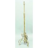 BRASS TELESCOPIC LAMP STANDARD, with twisting column and scrolling tripod base, height excluding