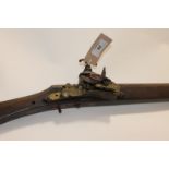 AN ARABIAN FLINTLOCK RIFLE. A well made flintlock action Jezail rifle, of the 19thC. The 52"