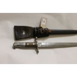 A SWISS BAYONET & SCABBARD. A Swiss K31 model bayonet with double-edged 11.5/8" blaade, complete