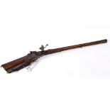 AN 18thC BAVARIAN HUNTING RIFLE. A wheel-lock German hunting rifle of considerable quality. Carved