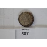 A VICTORIAN SHILLING PIECE. A Victorian 'frosted finish' shilling dated 1877