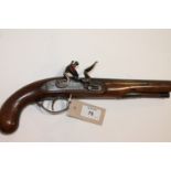 A FLINTLOCK PISTOL. A gentlemans flintlock pistol with fullstock and roller frizzen, 8" round form