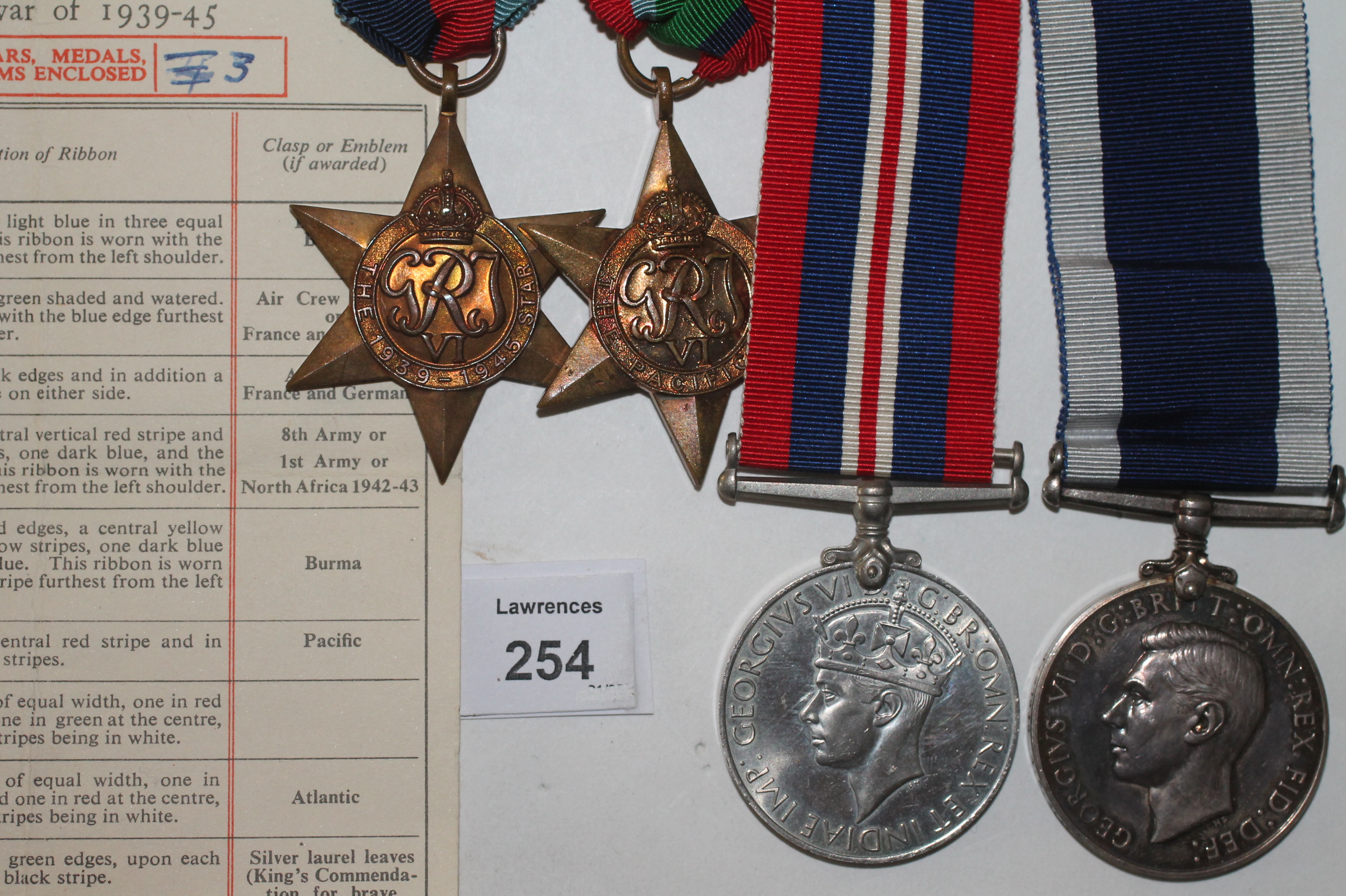 A PACIFIC STAR-LSGC R NAVY POW GROUP OF FOUR MEDALS. A 1939/45 & Pacific Stars, War Medal and Long