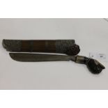 A BOLO KNIFE WITH SILVER MOUNTS. A Bolo bladed knife with carved wooden mounts, decorated with