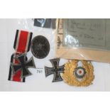 WW1 & WW11 GERMAN IRON CROSSES etc A quantity of German Military items including WW1 2nd Class