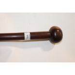 A KNOBKERRIE. A bi-wood patina Zulu knobkerrie, with an overall length of 38.1/2".