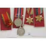 A WW11 S AFRICAN GROUP OF FOUR MEDALS. 1939/45 & Africa Stars, War Medal and an Africa Service Medal