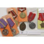 RUSSIAN & GERMAN MEDALS. Including a West Wall medal and an Eastern Front Medal. (5) Russian