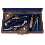 CASED FLINTLOCK POCKET PISTOLS. Two French Flintlock turn-off barrels pocket or coat pistols, marked