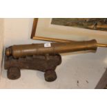 A SIGNAL CANNON A brass 24" barrelled model signal cannon with partial trunnion, having a 1.1/4"